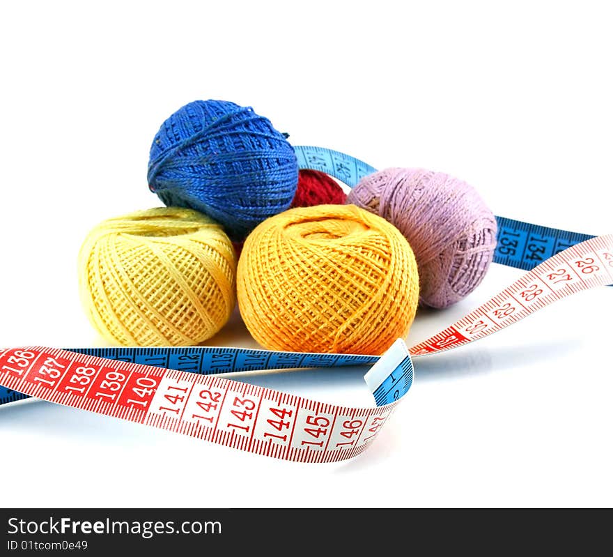 Balls and measuring tape isolated on a white background