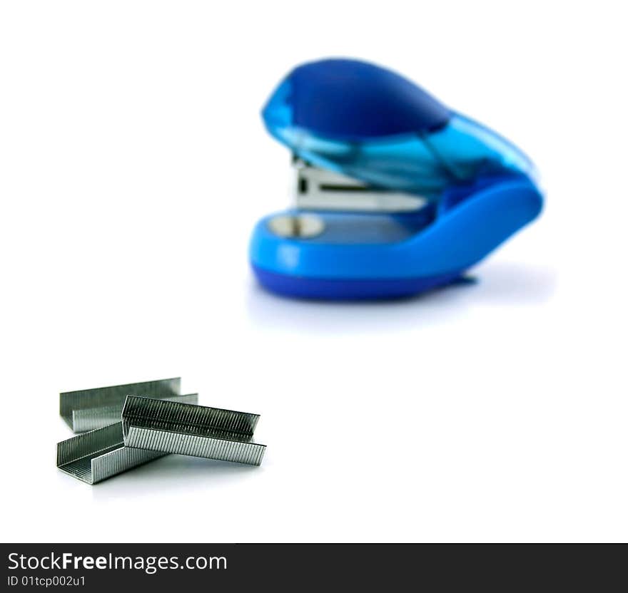 Stapler and staples isolated on a white background