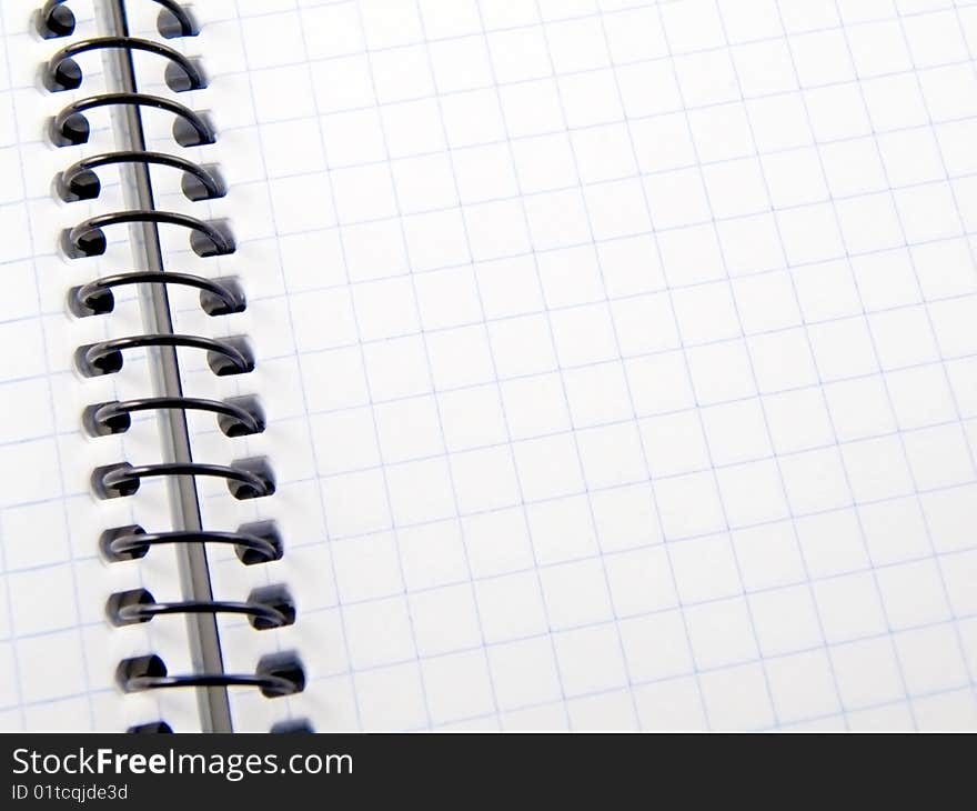 An open spiral bound notebook with lined paper