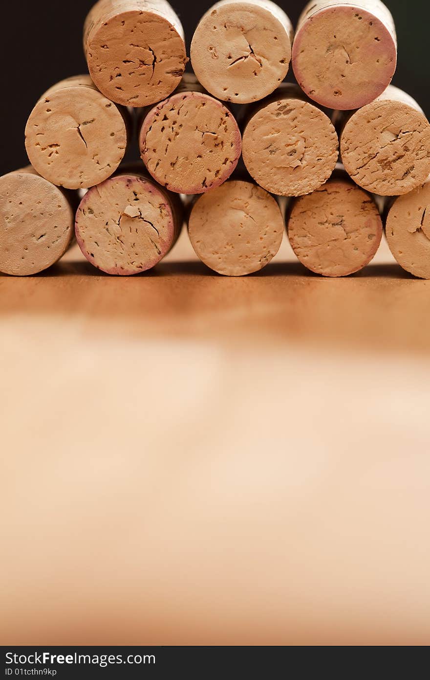 Stack of Wine Corks on a Wood Surface.