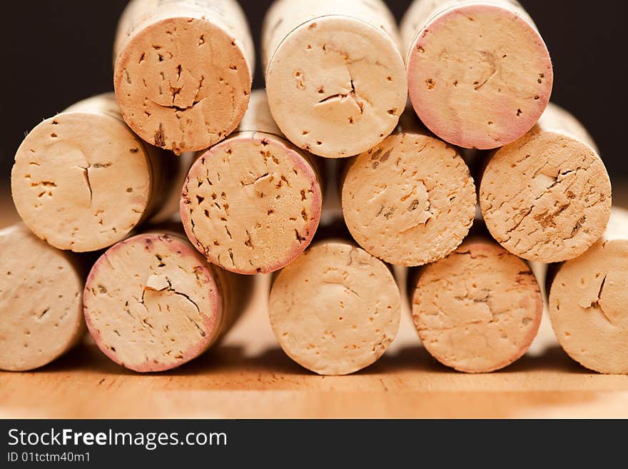 Stack of Wine Corks on a Wood Surface.