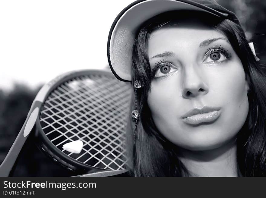 Pretty tennis player in monochrome