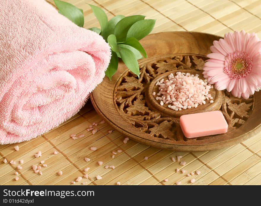 Spa concept. Towel, soap, bath salt and gerber.