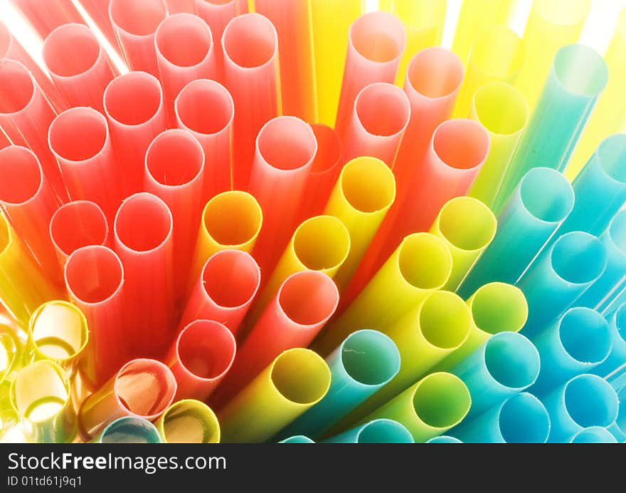 Detail of a bundle of drinking straws, lit from behind. Detail of a bundle of drinking straws, lit from behind.