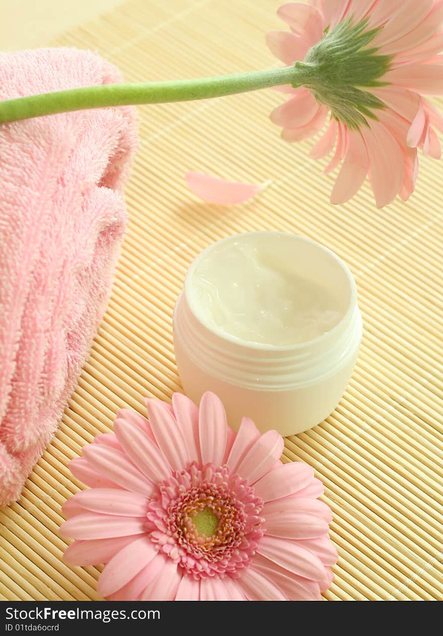 Spa essentials. Cream and flowers.