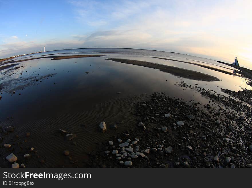 Sunset on the sea shore, fisheye distortion