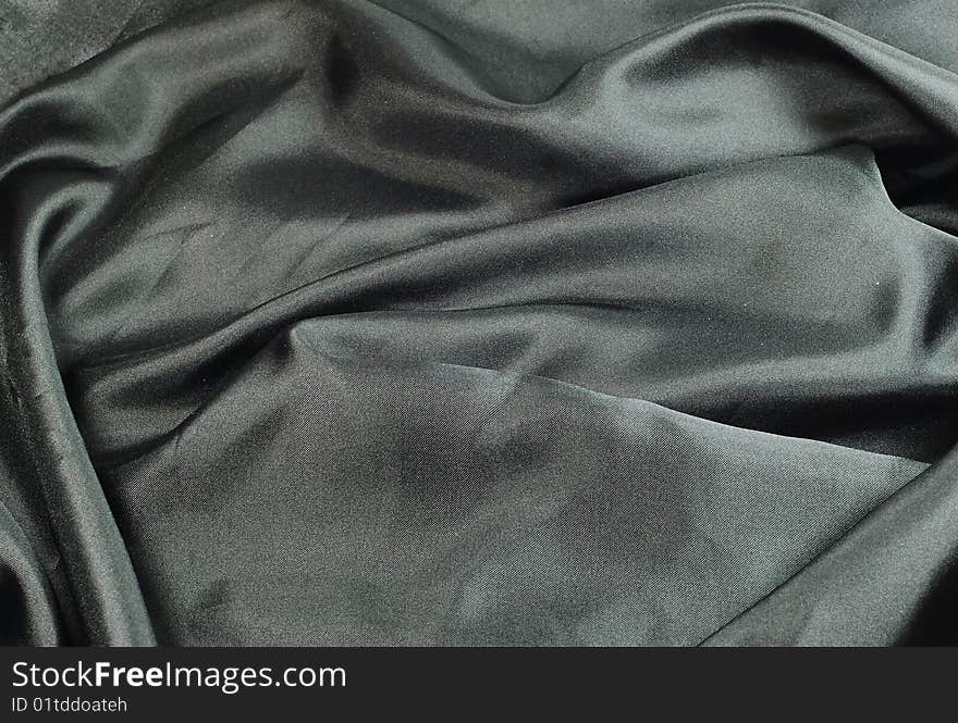 Closeup of beautiful black satin fabric