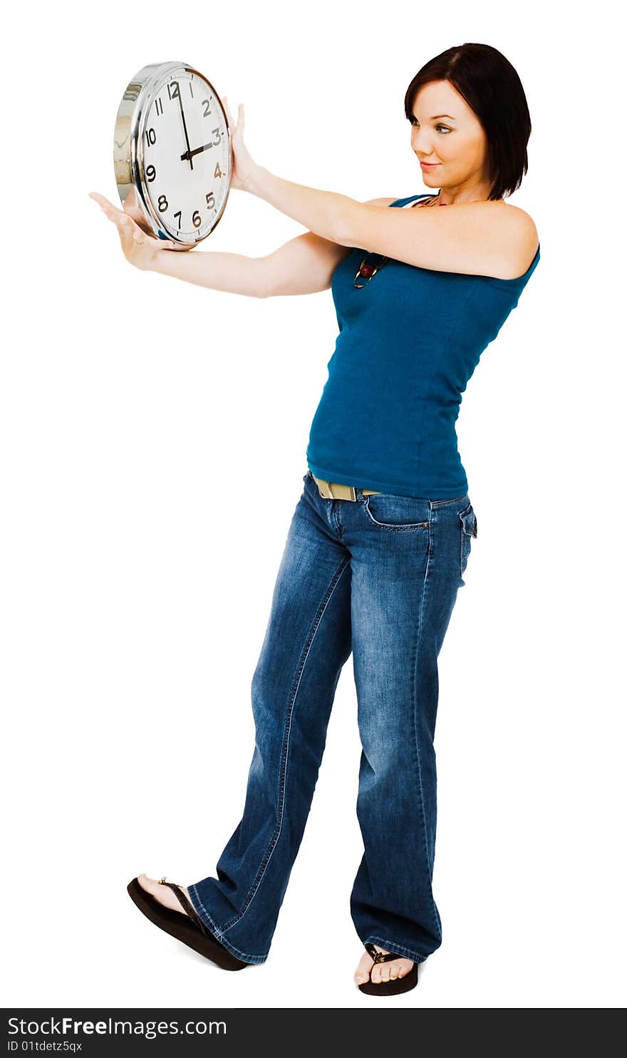 Young woman holding a clock isolated over white. Young woman holding a clock isolated over white