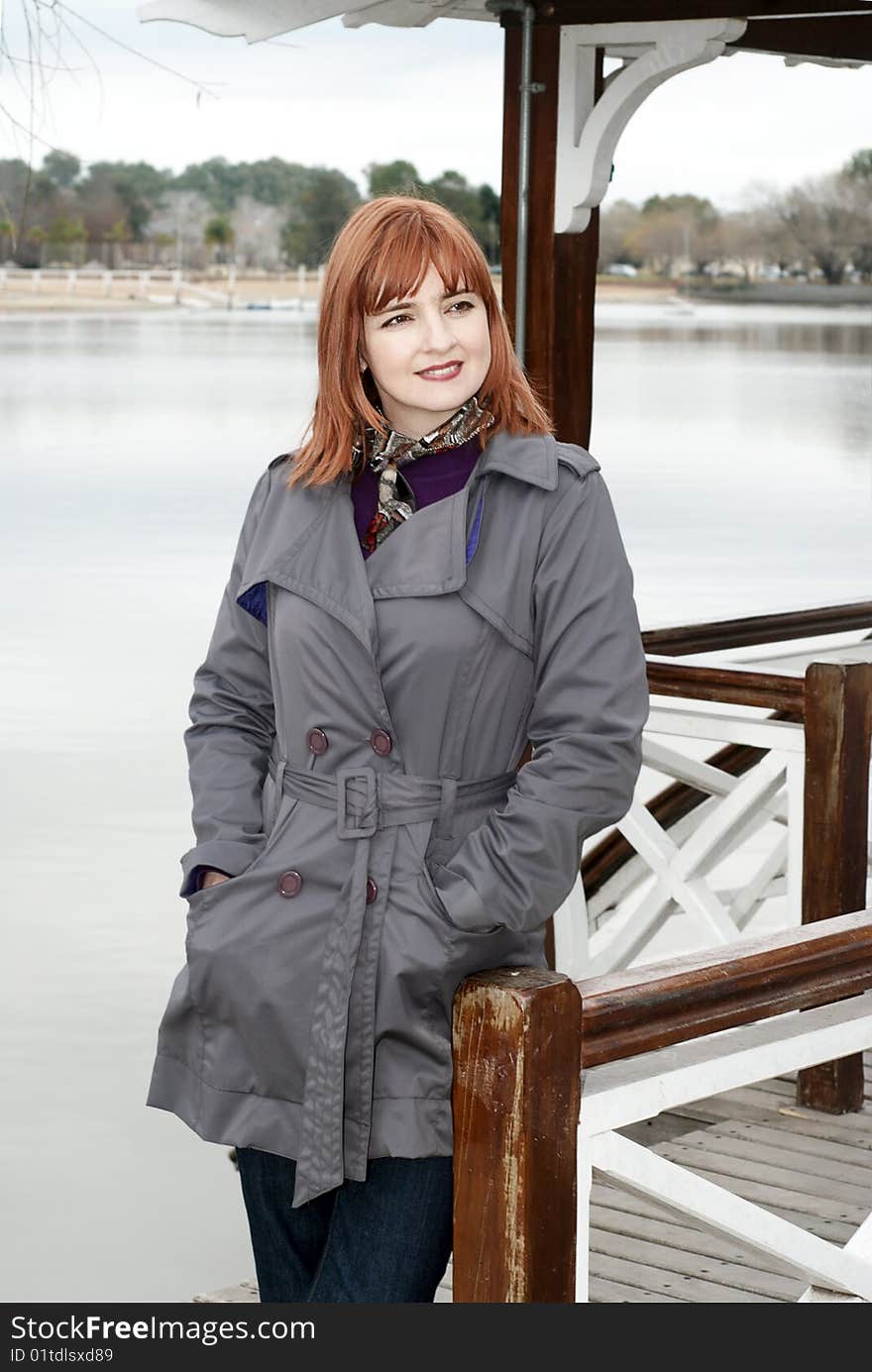 Portrait of a beautiful woman on the bank of lake