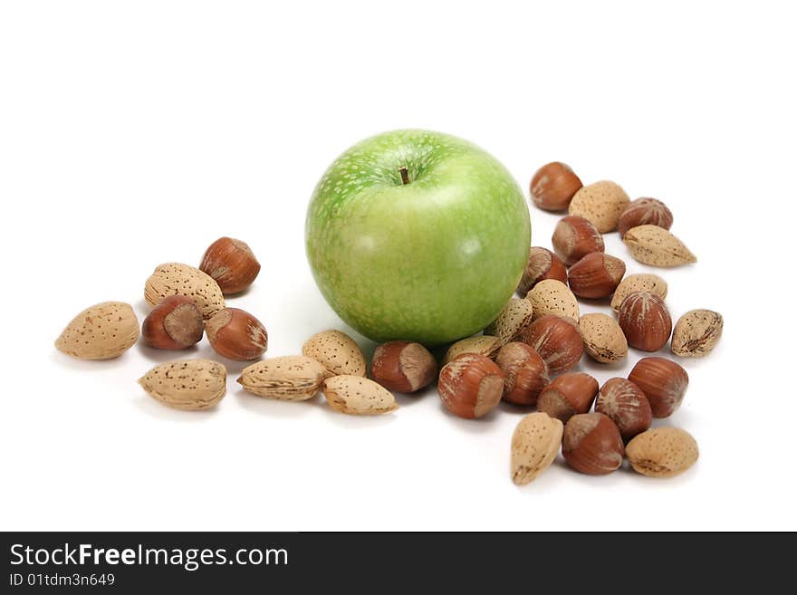 Apple with almonds and hazelnuts, isolated on white. Apple with almonds and hazelnuts, isolated on white