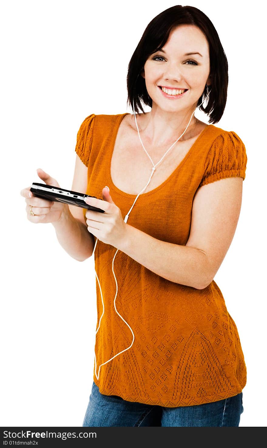 Beautiful woman listening to music on an media player isolated over white. Beautiful woman listening to music on an media player isolated over white