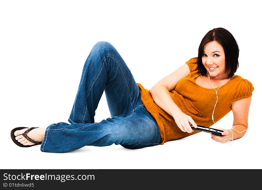 Woman listening to music on an media player isolated over white. Woman listening to music on an media player isolated over white