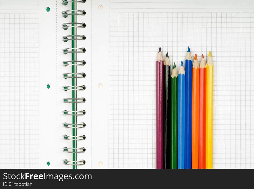 Close up of notebook and pencil on white background with clipping path