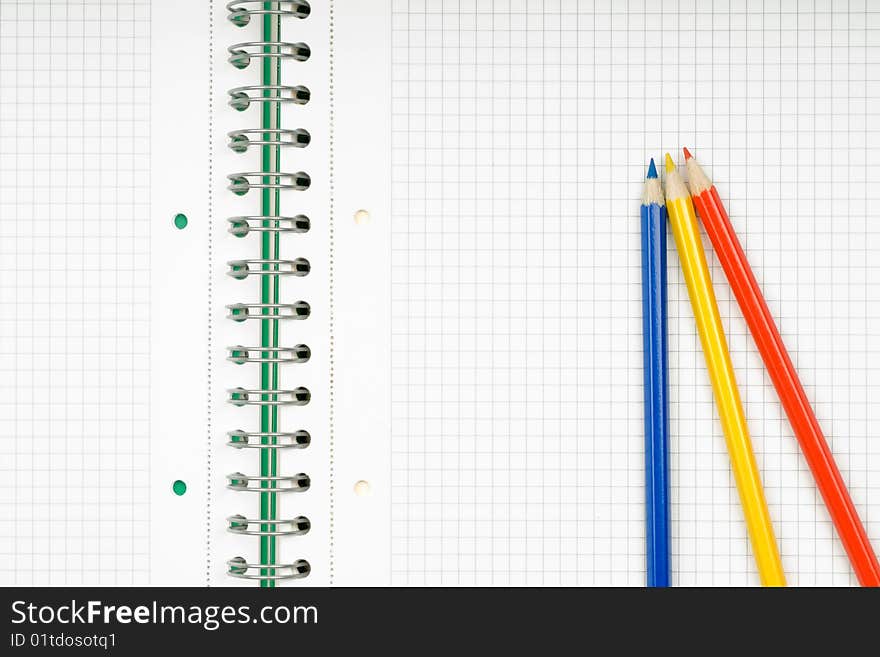 Close up of notebook and pencil on white background with clipping path