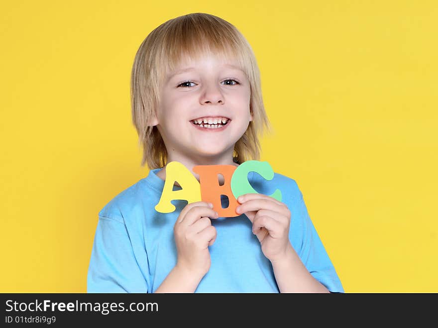 The small schoolboy with letters