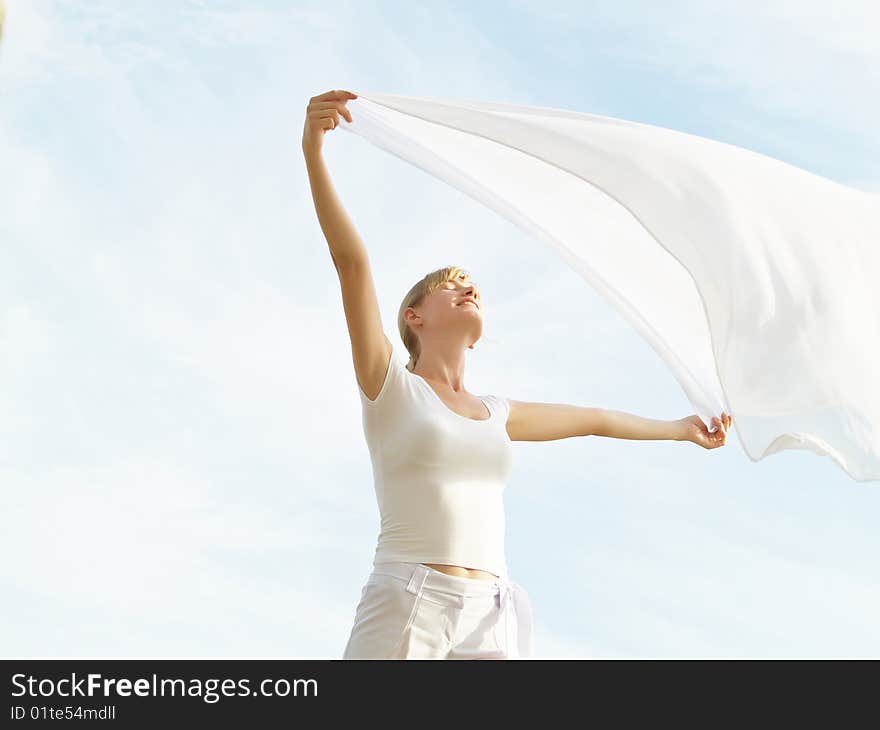 Session of a relaxation on a background of the years sky of the girl in white