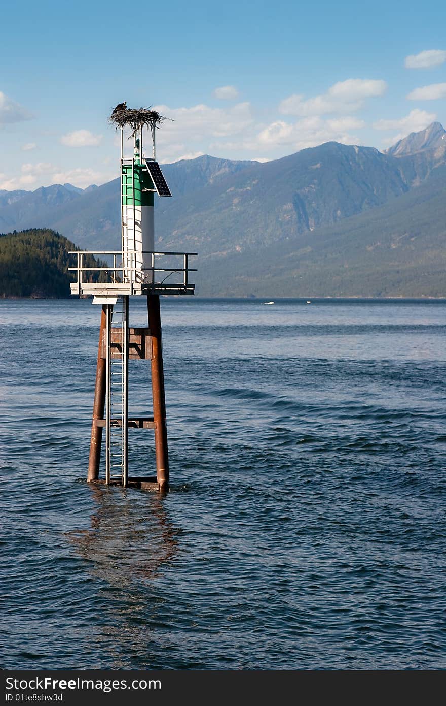 Eagle's nest on lighthouse in middle of lake