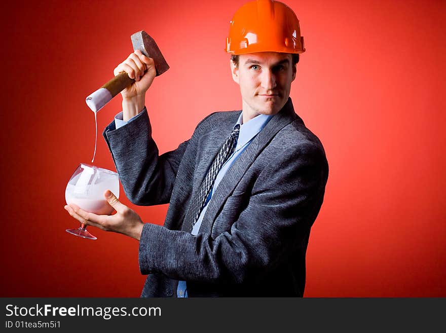 The man in a helmet with a hammer and yoghurt