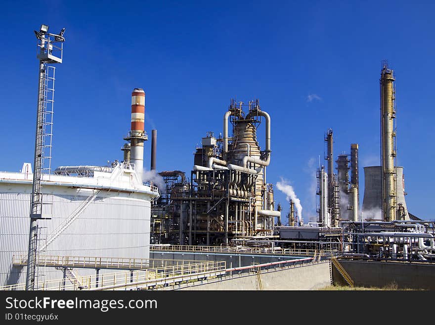 Oil refinery in Italy with tall smokestacks