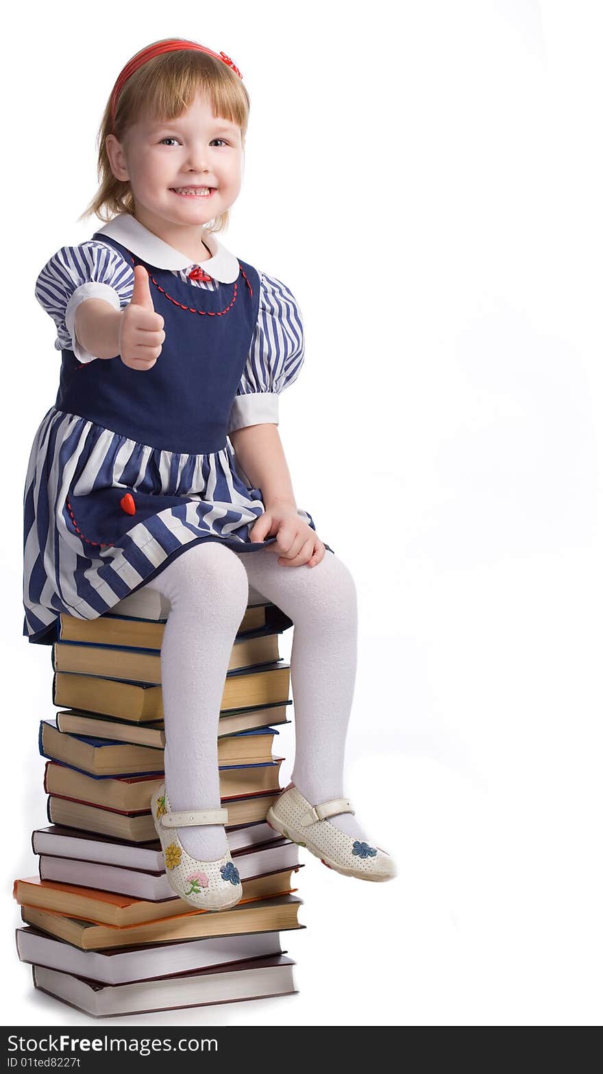 Little baby with books isolated