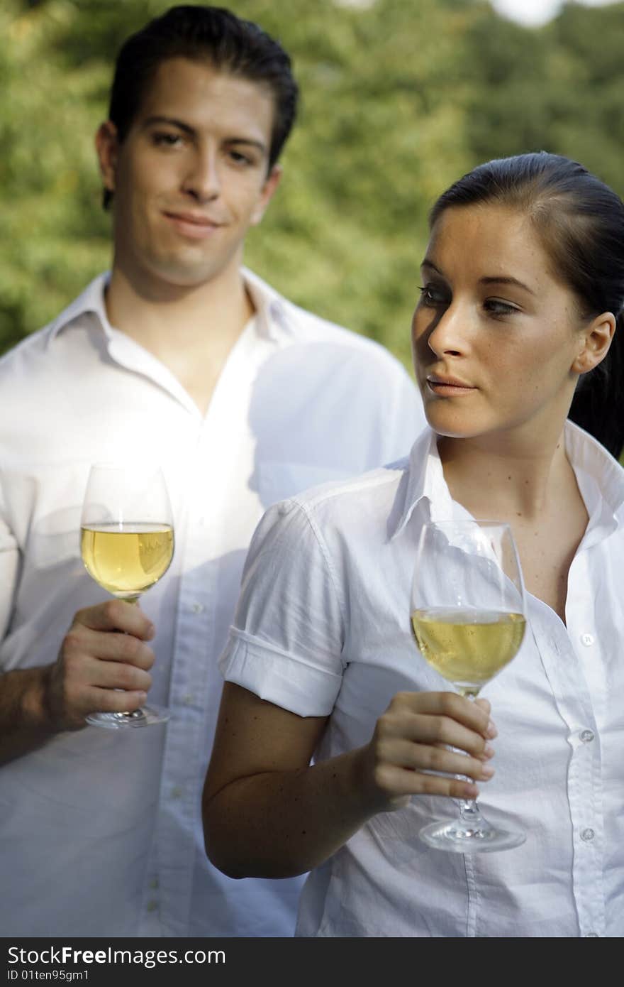 Young couple with glas of wine outdoor