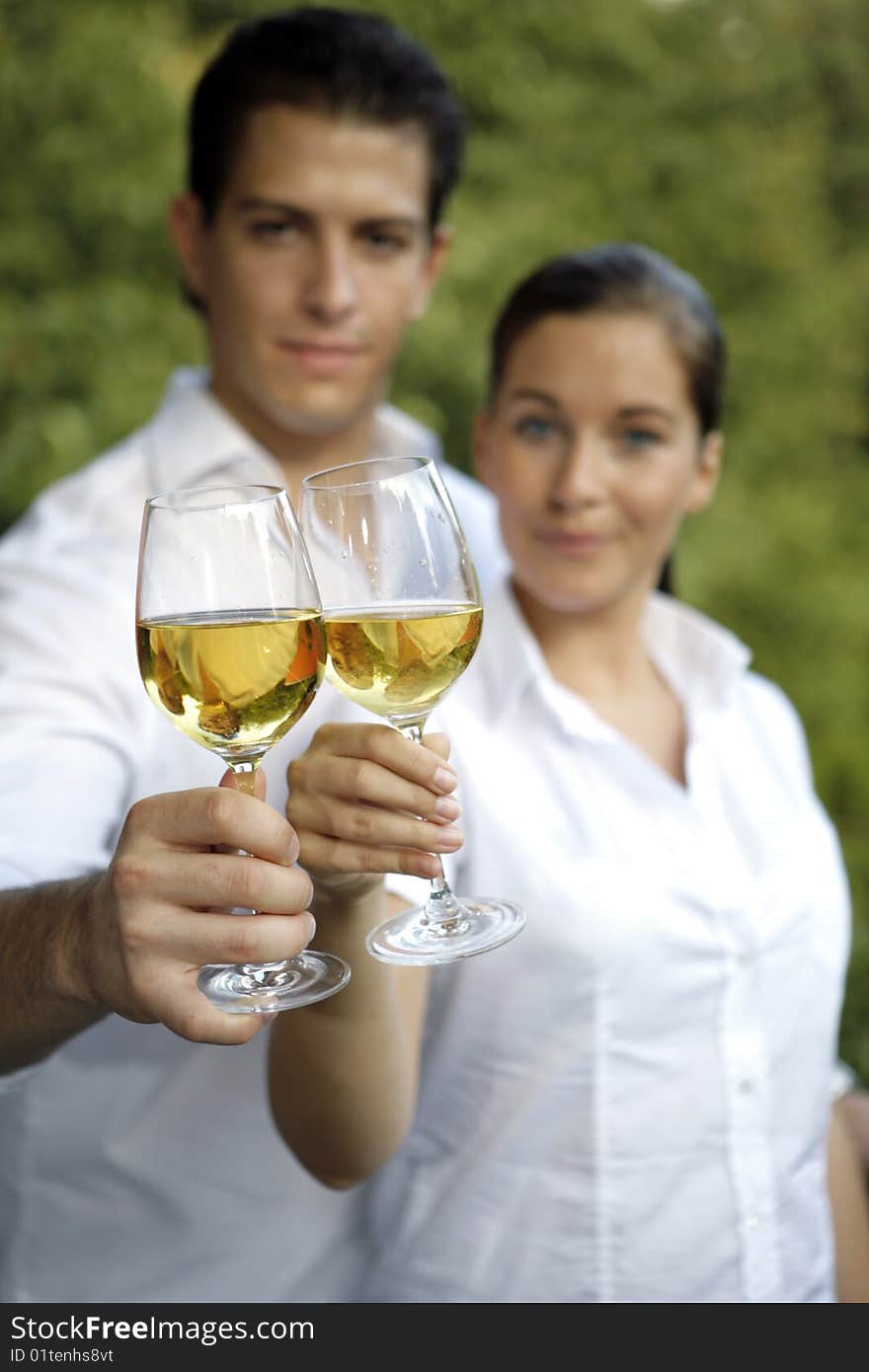 Young couple with glas of wine outdoor