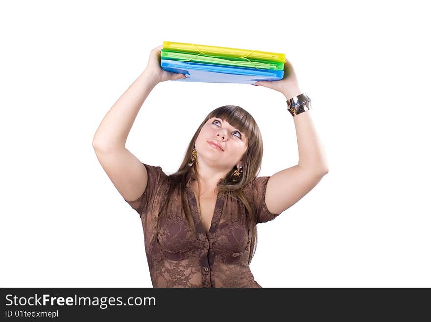 The young beautiful businesswoman at office behind work on a white background. The young beautiful businesswoman at office behind work on a white background