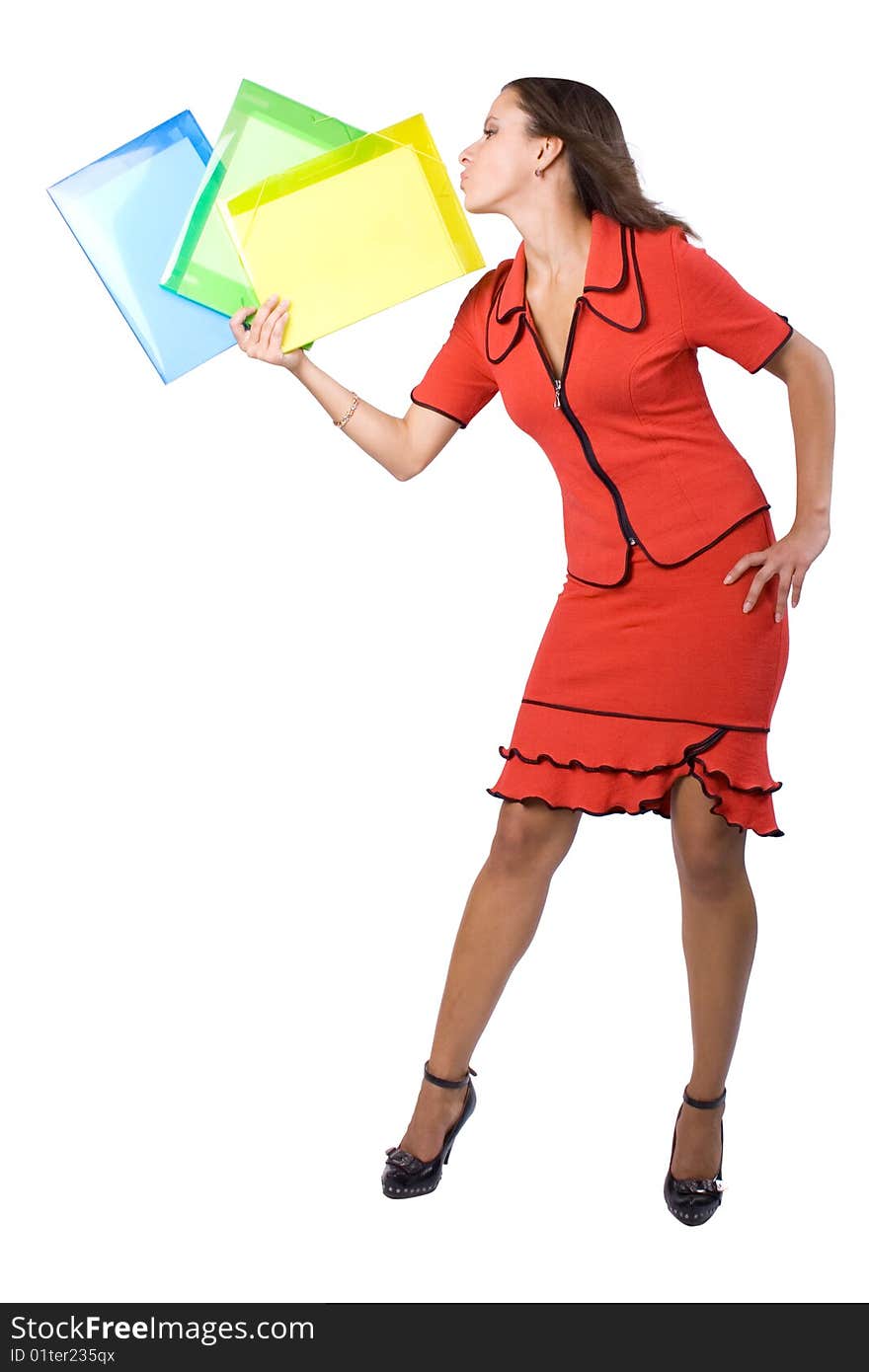 The young beautiful businesswoman at office behind work on a white background. The young beautiful businesswoman at office behind work on a white background