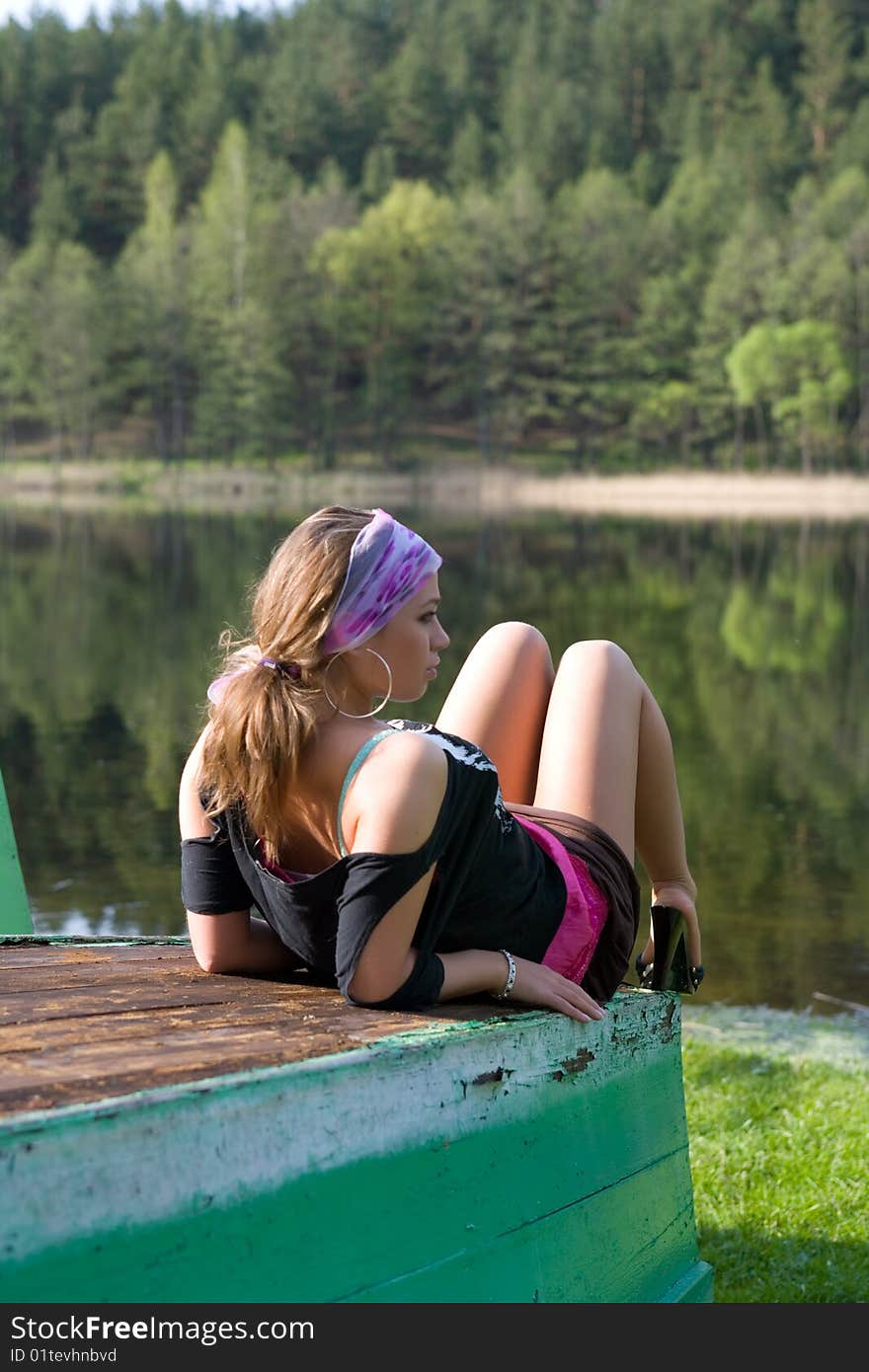 Portrait of young sexual girl on lake background