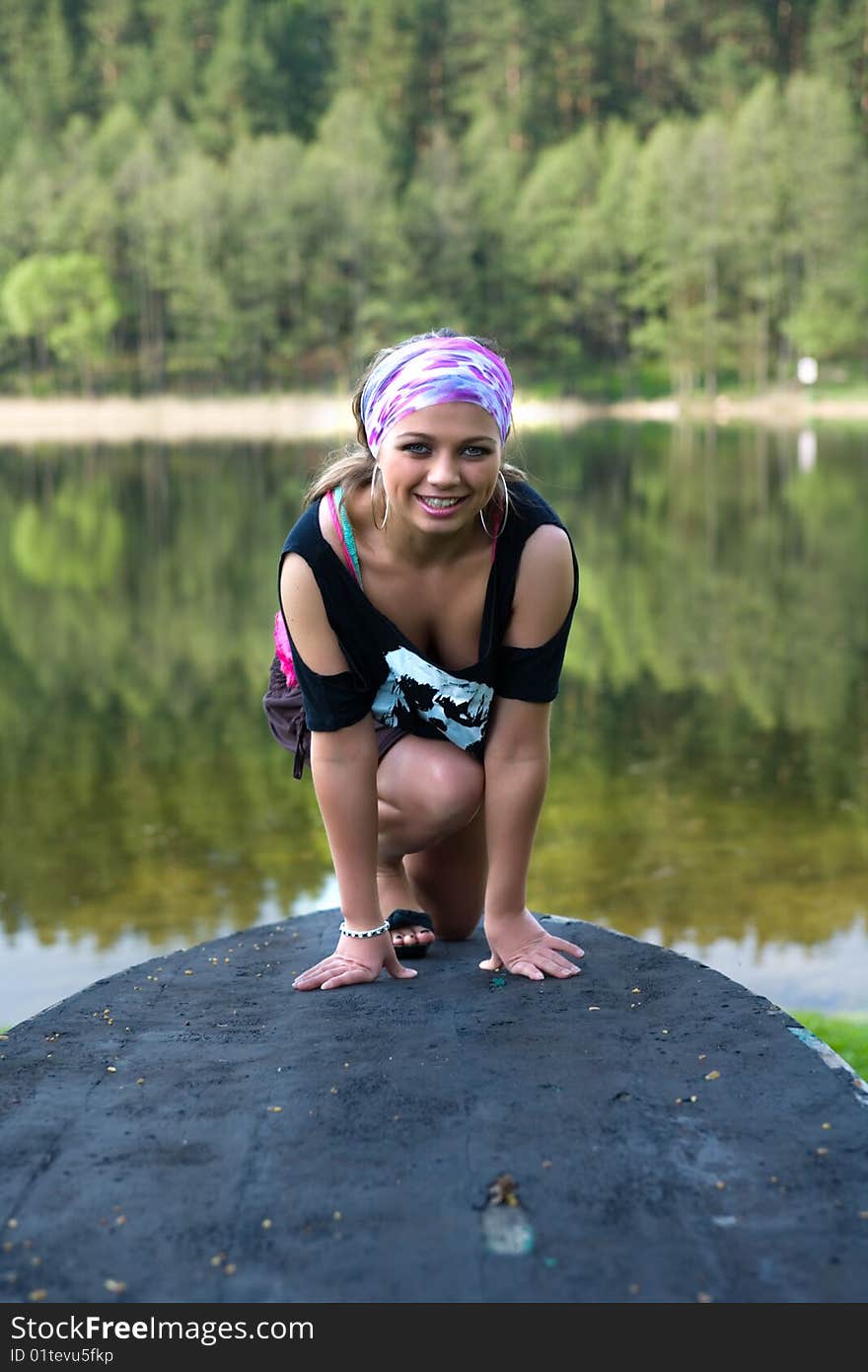 Portrait of young sexual girl on lake background