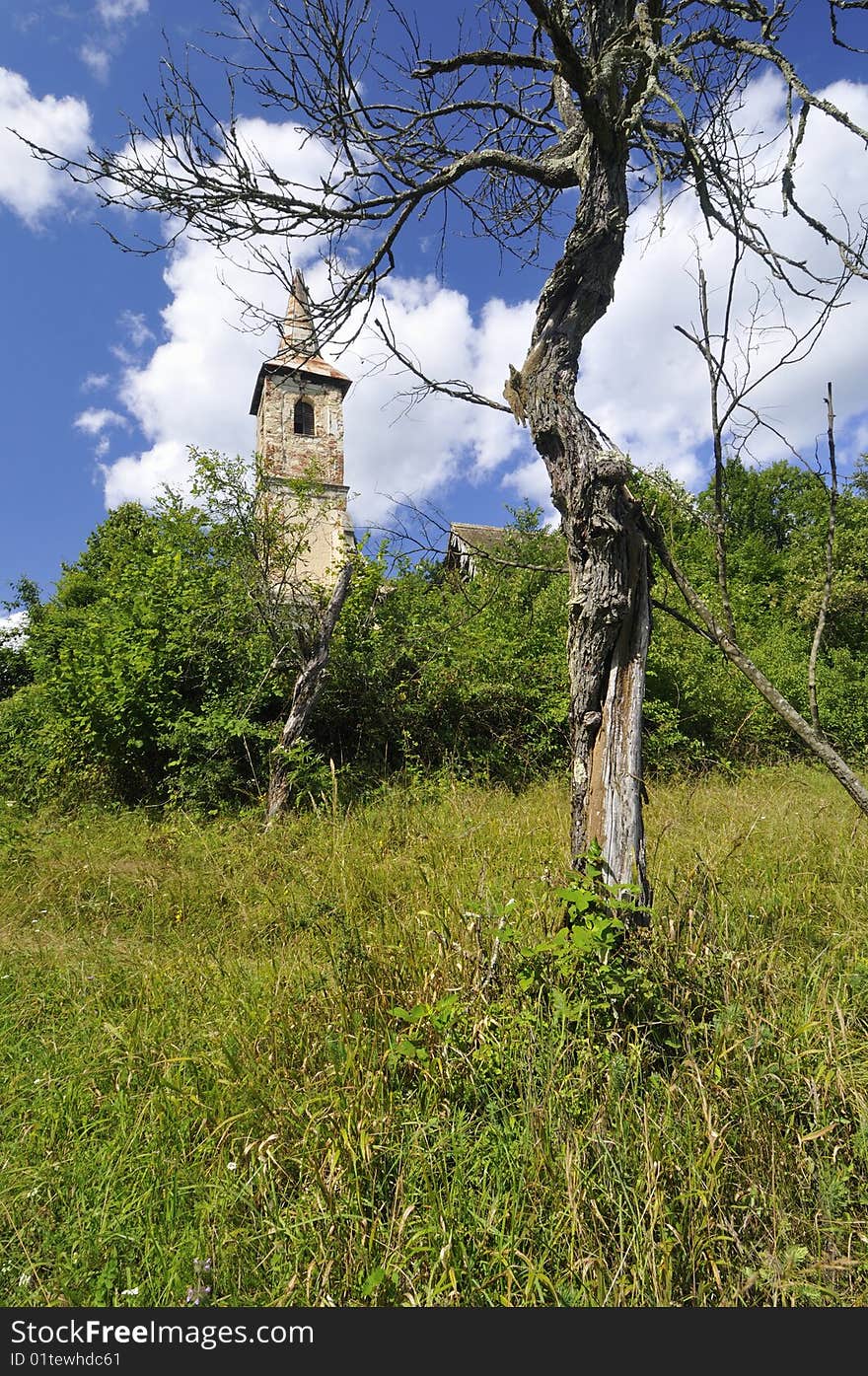 Old Catholic church on a hill near the village. Old Catholic church on a hill near the village