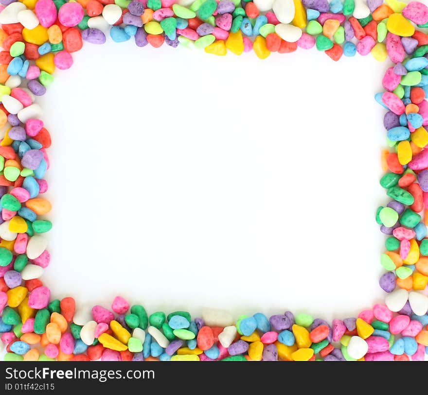 Rectangular frame arranged from different colorful stones close up on white. Rectangular frame arranged from different colorful stones close up on white.