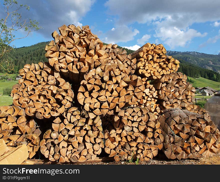 Lots pile of woods in Gosau village , a beautiful village in salzkammergut of Austria. Lots pile of woods in Gosau village , a beautiful village in salzkammergut of Austria.