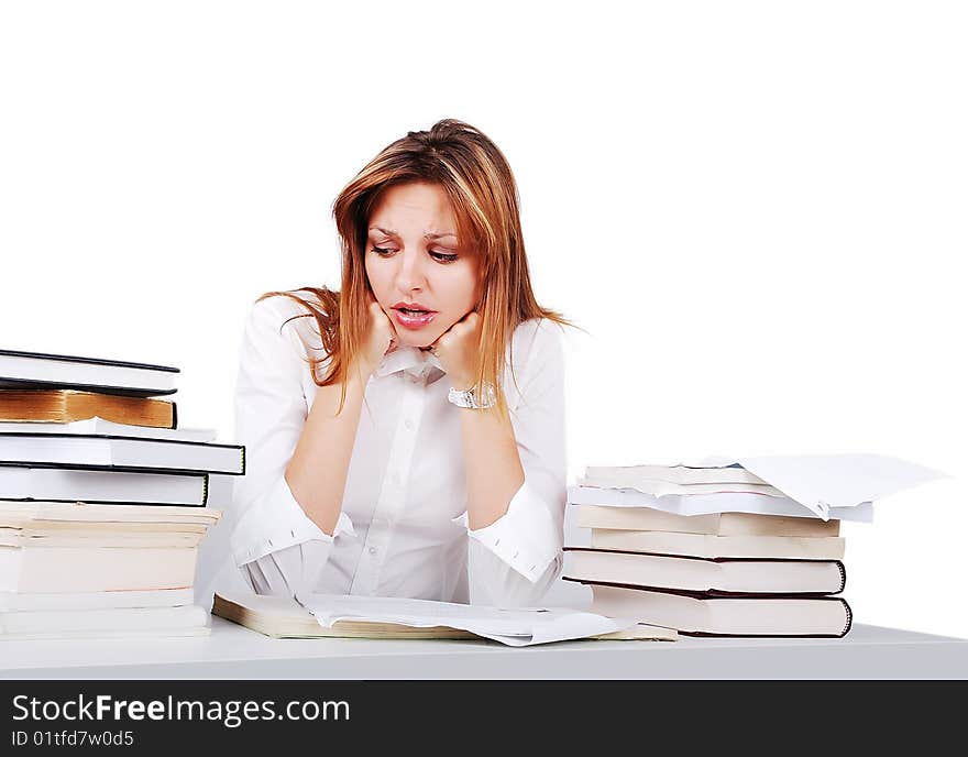 Worried girl between lot of books