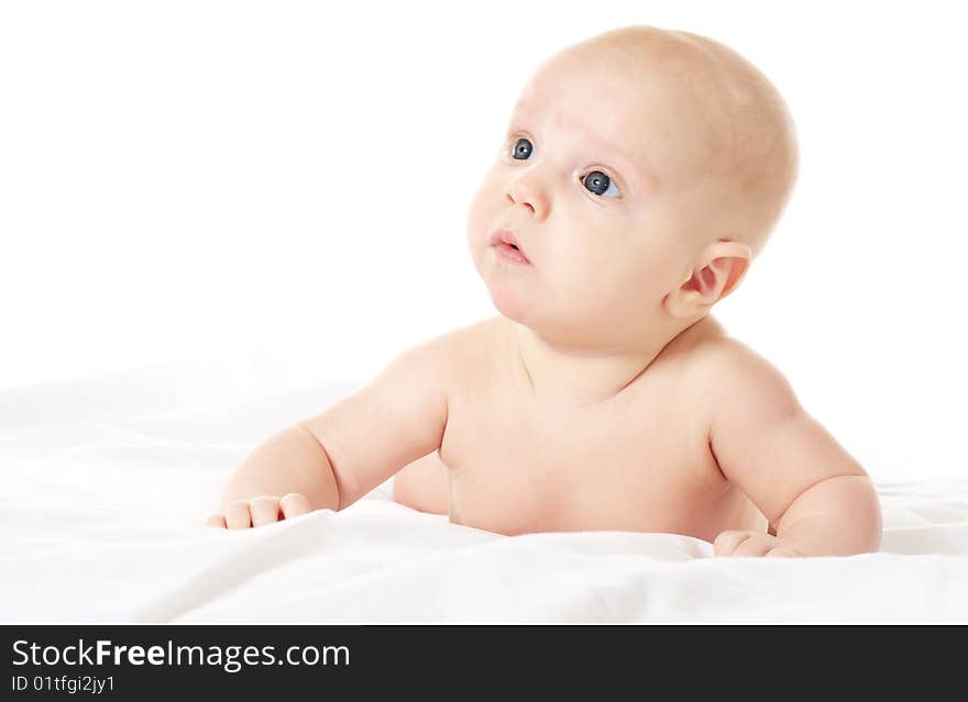 Cute baby boy on white blanket