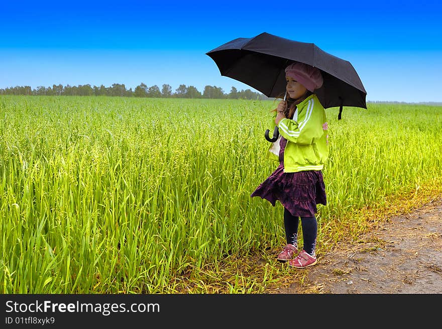 The lonely girl on a farmer field