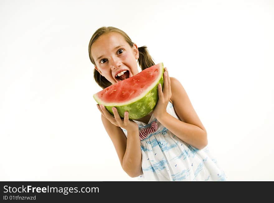 Young girl eating a watermelon