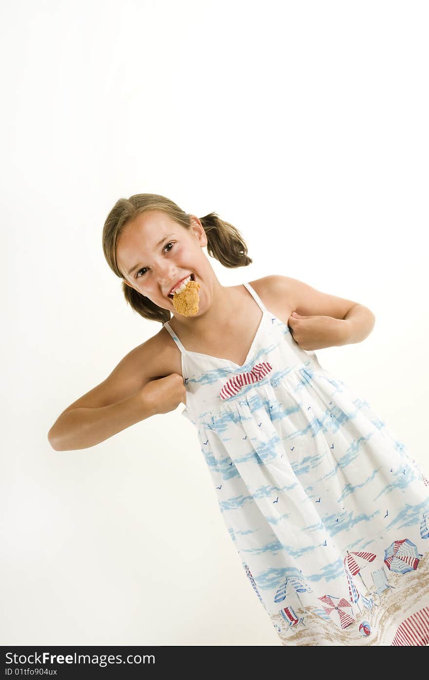 Young girl acting like a chicked while eating a chicken finger. Young girl acting like a chicked while eating a chicken finger