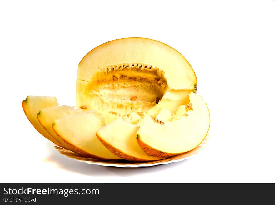 Ripe, yellow melon on a white background