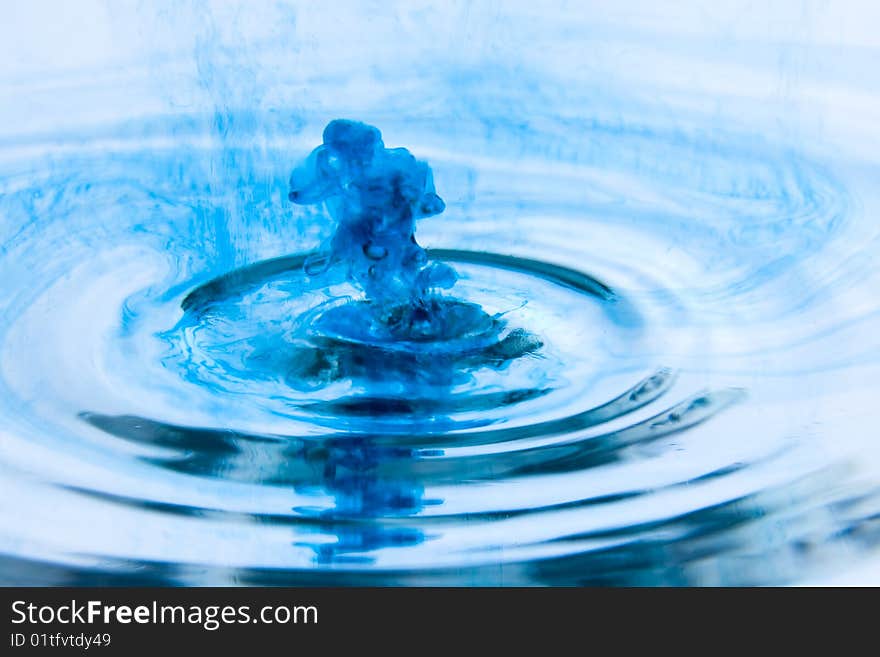 Blue drop hang suspended in time