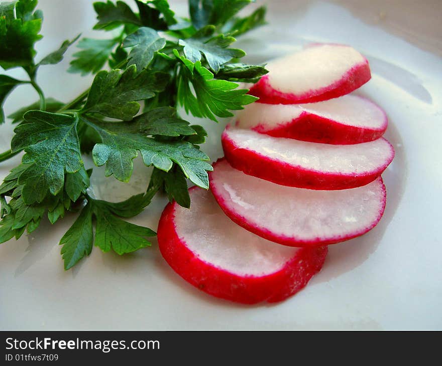 Cut Garden Radish And Leaves Of Parsley