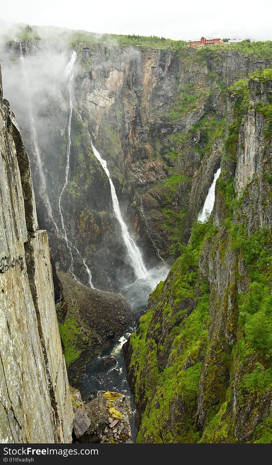 The falls fall from the big height in narrow gorge