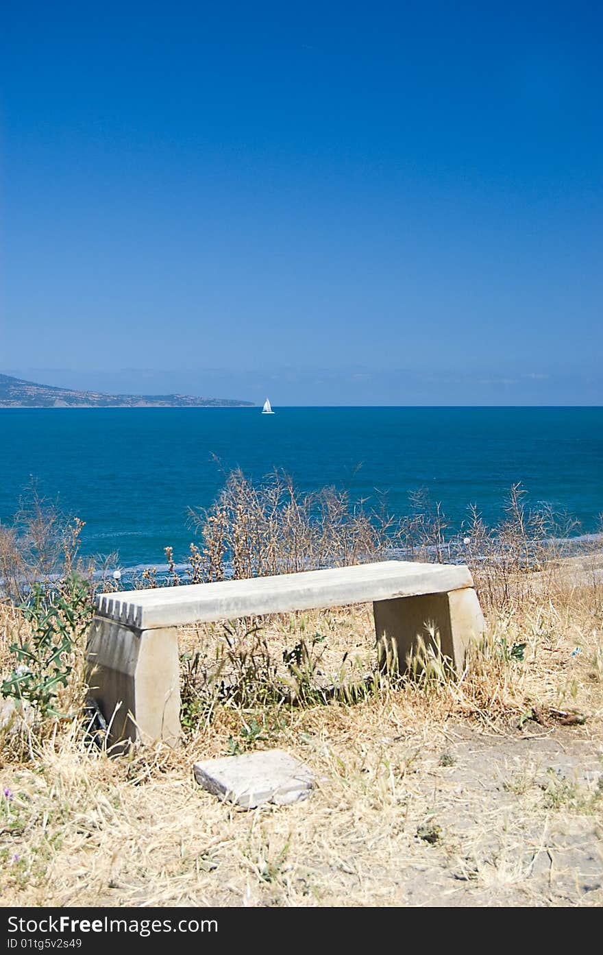 Empty Bench Looking Onto The Sea