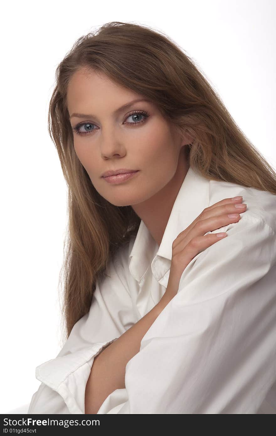 Portrait close up of the young woman of the European type with blue eyes, on a white background