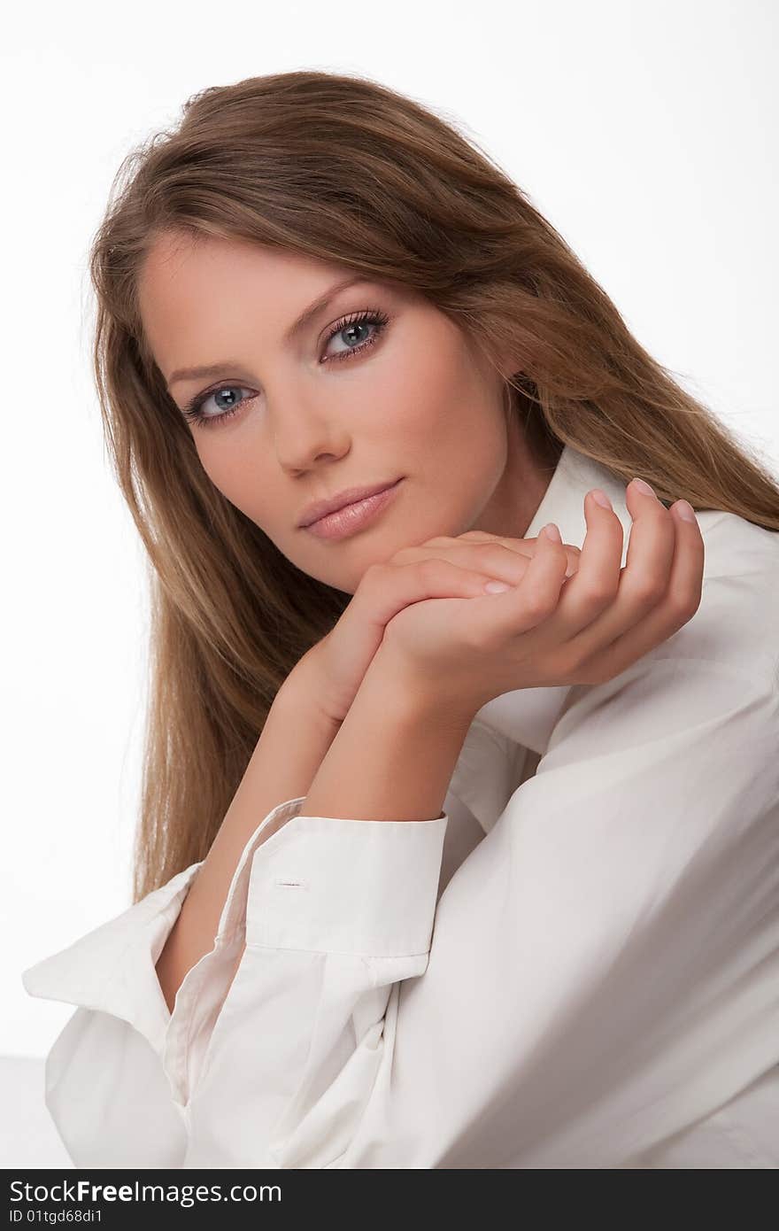 Portrait close up of the young woman of the European type with blue eyes, on a white background