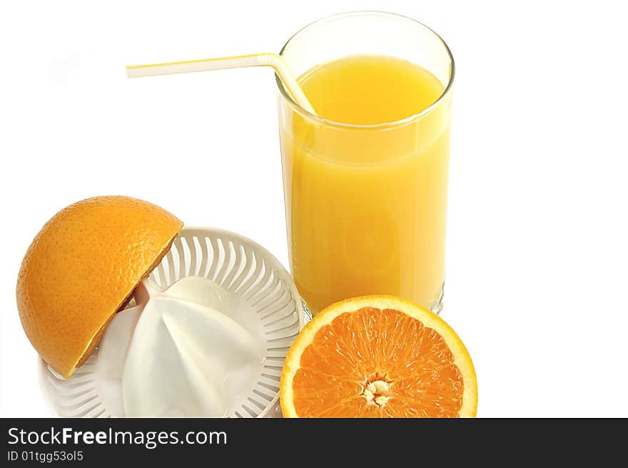 Juicer with slices of orange and glass of fresh juice isolated over white. Juicer with slices of orange and glass of fresh juice isolated over white.