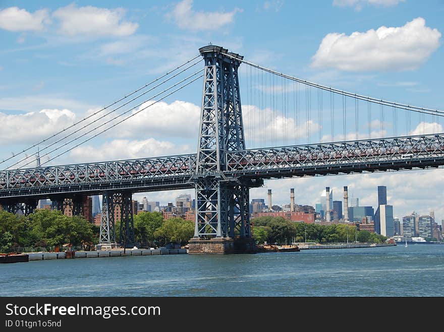 The Williamsburg Bridge's west tower with its steel girder design spans the East River and connects Manhattan to the Williamsburg district in Brooklyn.  (Lee Snider Photo). The Williamsburg Bridge's west tower with its steel girder design spans the East River and connects Manhattan to the Williamsburg district in Brooklyn.  (Lee Snider Photo)