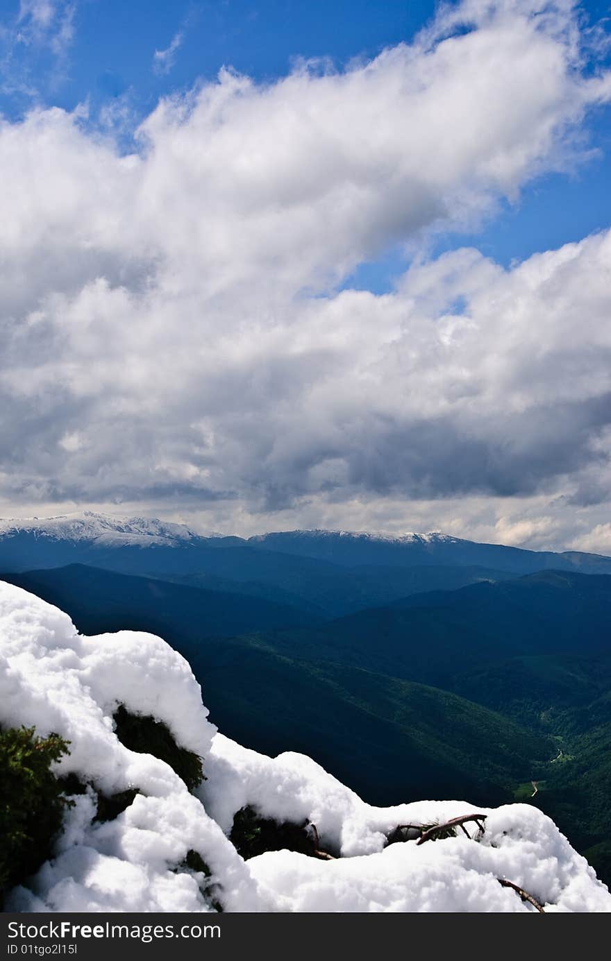 A mountain landscape through the clouds