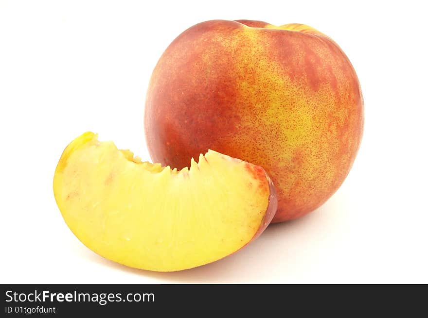 Cut peach on a white background. Cut peach on a white background