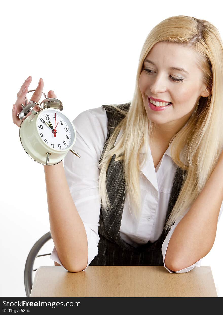 Portrait of businesswoman with an alarm clock